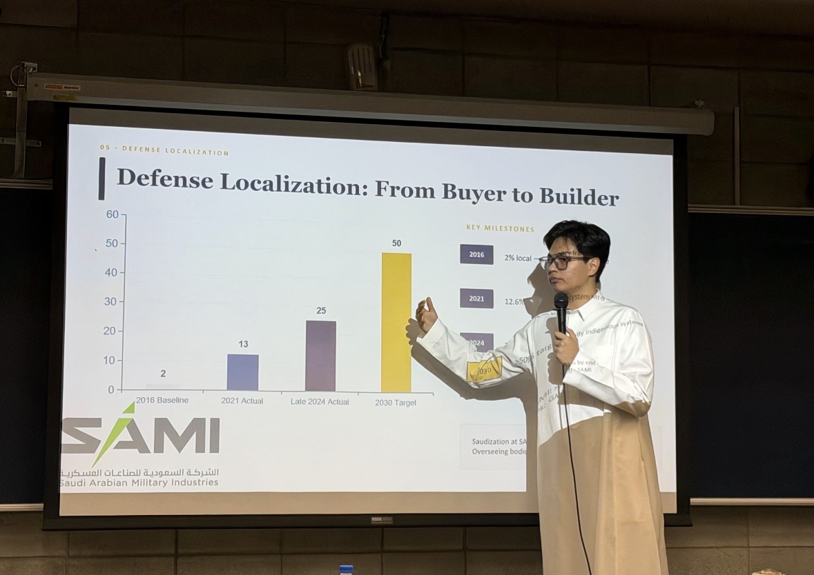 Faisal Ma presenting a slide about defense localization at Shih Chien University